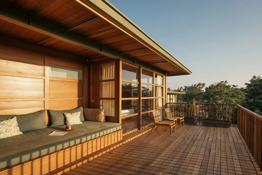 Treehouse Villa second floor balcony with sofa and sunset view